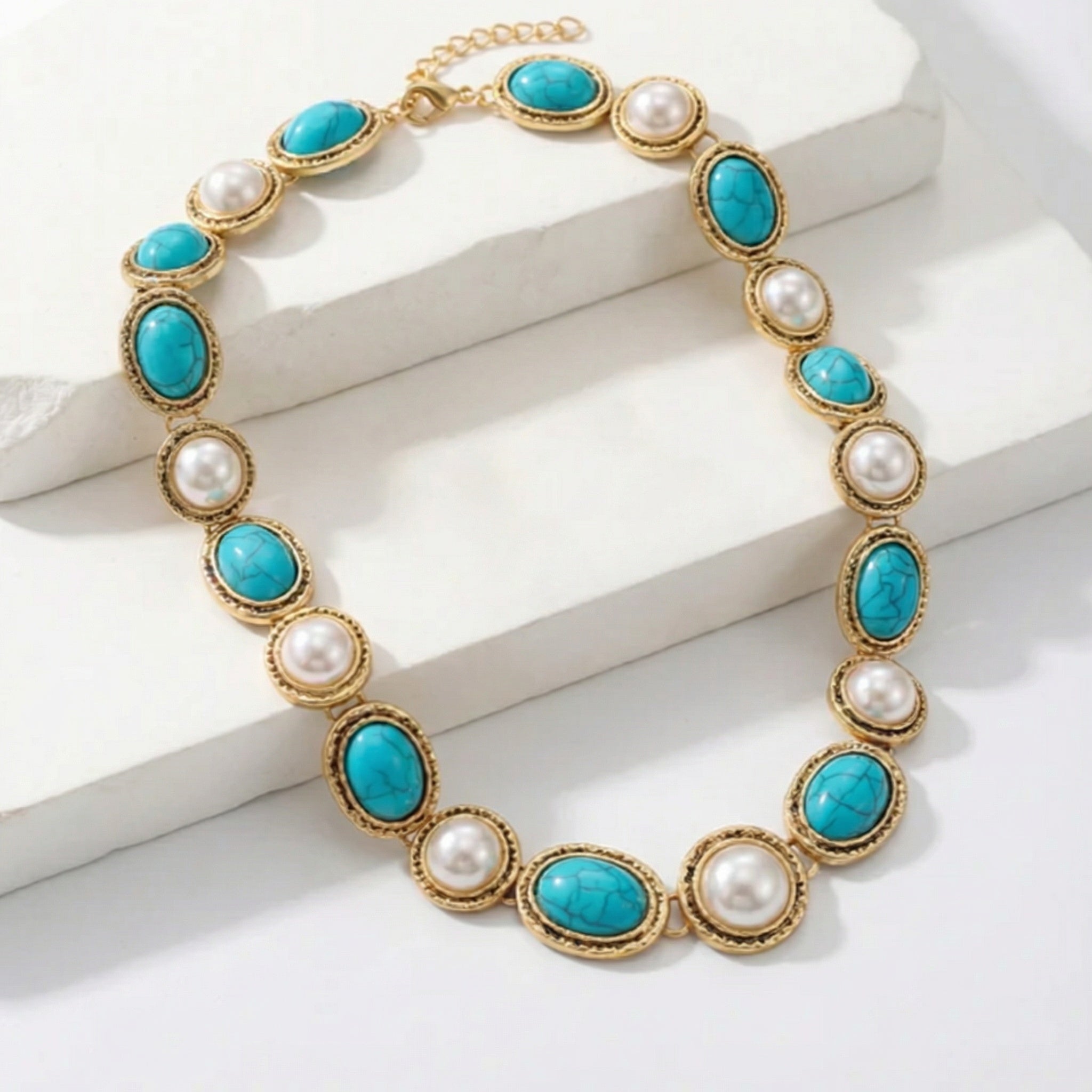 Set statement in oro antico con turchese e perla